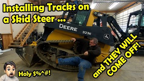 change tracks john deere skid steer|Changing tracks on John Deere 323D skid steer Part 2  .